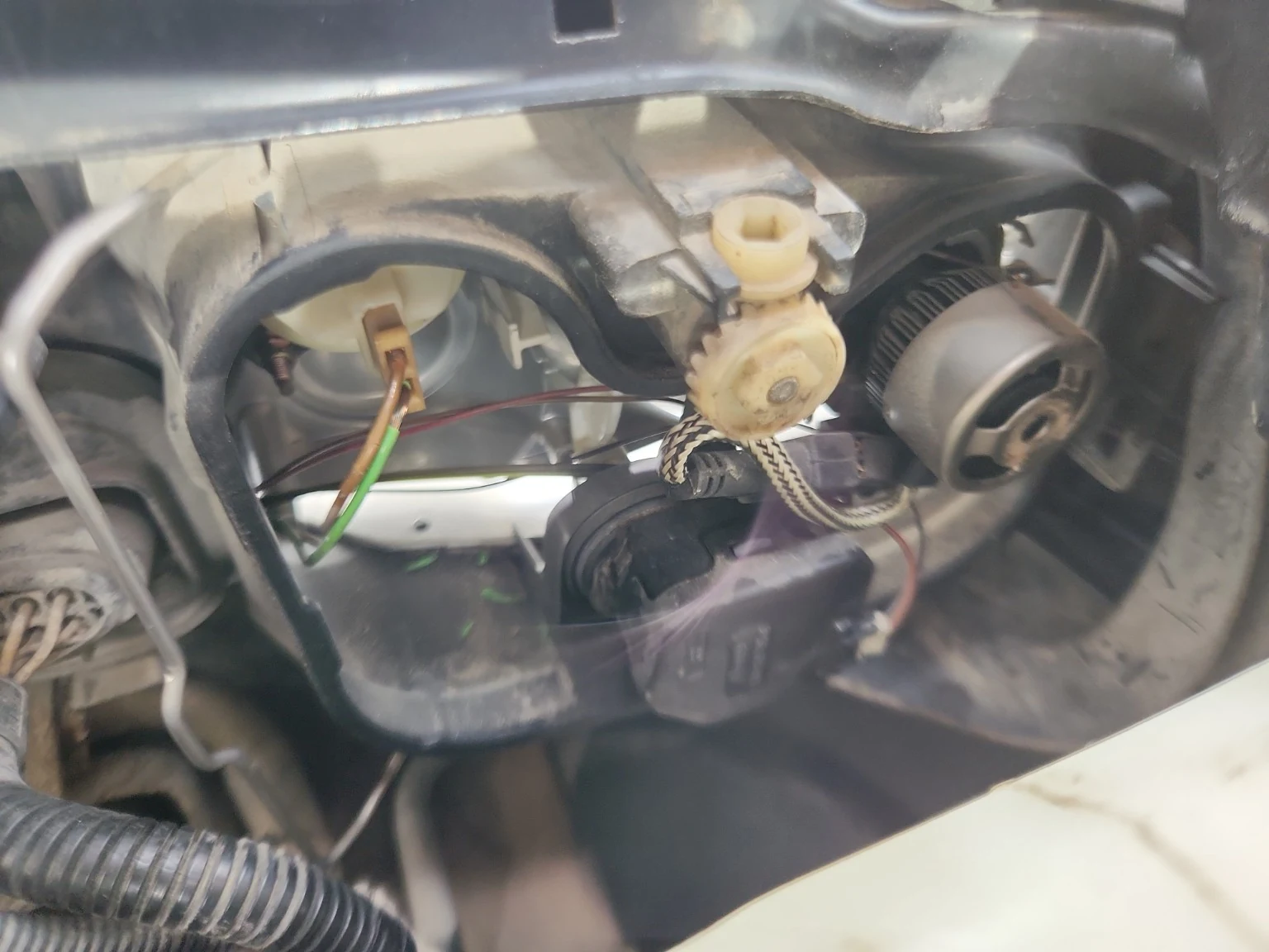 Rear view of the headlight housing with the fan-cooled LED low beam bulb setup.