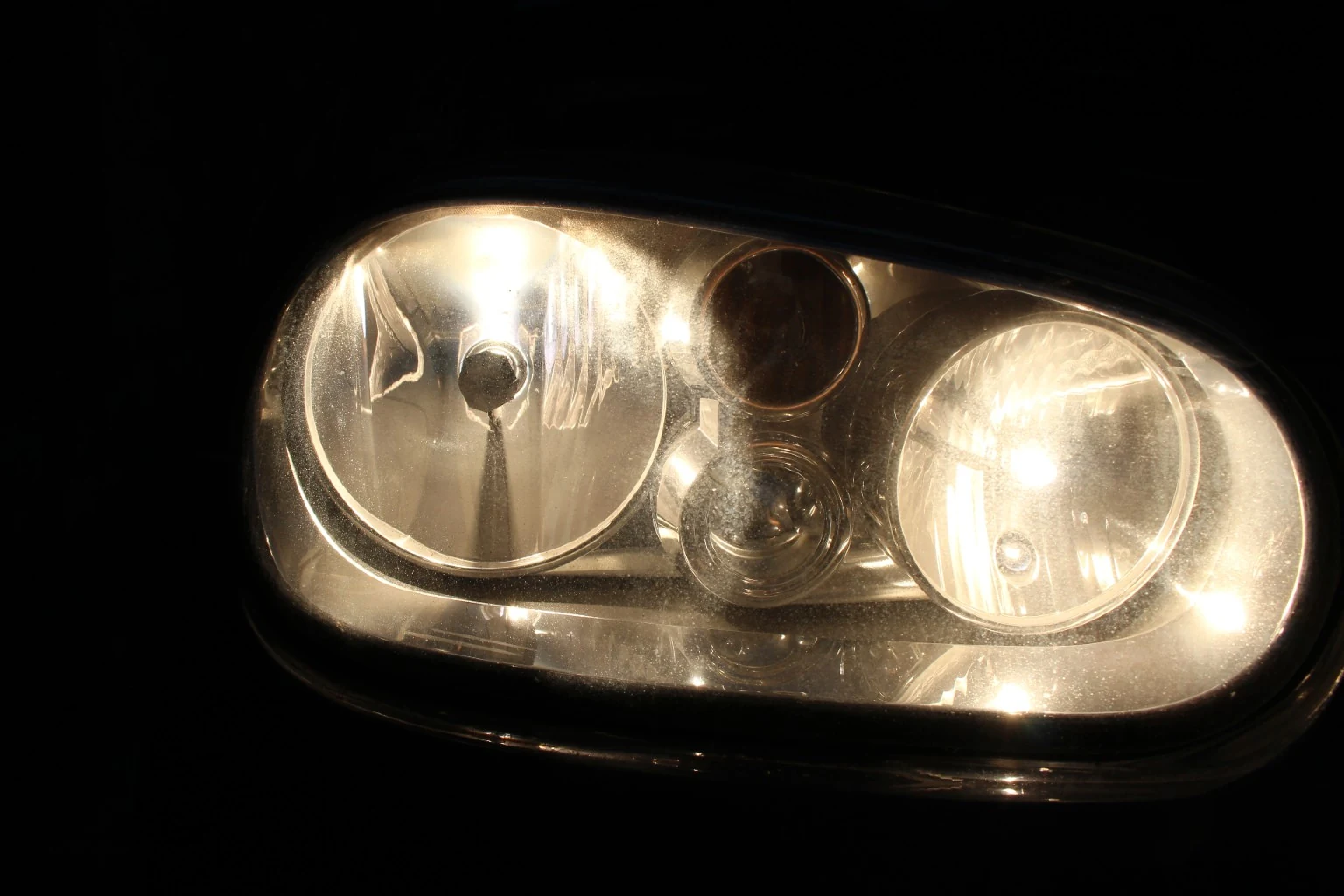 Close-up of the renewed front lighting with the new halogen low beam installed.